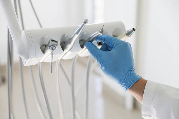 Professional Tooth Extraction technician working in Candler-McAfee, GA
